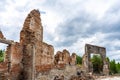 Destroyed wall. Fragments of the wall against the sky. Ruins of houses. Summer day