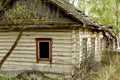 Destroyed wooden old houses in an abandoned village evicted during the Chernobyl accident at a nuclear power plant.