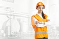 Destroying gender stereotypes. Female builder standing against industrial background