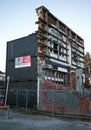 Rubble of partially collapsed old historic architecture supported by steel frame seismic bracing in Christchurch, New Zealand