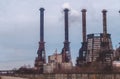 Destruction of the environment. Smokestacks of a chemical plant Royalty Free Stock Photo