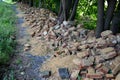 Destruction of the garden fence. badly fired bricks succumbed to erosion. water and snow flowed inside the wall and the frost tore