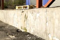 Destruction of plaster on the facade of an industrial building