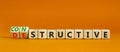 Destructive or constructive symbol. Turned wooden cubes and changed the concept word Destructive to Constructive. Beautiful orange