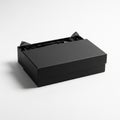 With a detachable lid, partially open, revealing black tissue Royalty Free Stock Photo
