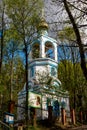 The detached bell tower of the Russian Orthodox Church surrounded by trees: Russia Royalty Free Stock Photo