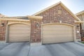 Detached double garage exterior with bricks and concrete driveway