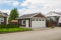 Detached garage of residential house with asphalt road in front. Royalty Free Stock Photo