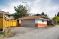 Detached garage of residential house with asphalt road in front Royalty Free Stock Photo