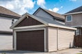 Detached garage of residential house with asphalt road in front Royalty Free Stock Photo