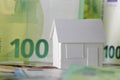 A detached house model and European Union currency Royalty Free Stock Photo