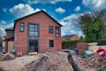 A detached house under construction on a building site in the UK, closed during the UK Government coronavirus lockdown
