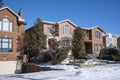 Detached middle class single family houses on a sunny day in winter Royalty Free Stock Photo