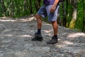 detached sole on the tourist's sneakers. They broke their boots in the woods Royalty Free Stock Photo