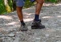 detached sole on the tourist's sneakers. They broke their boots in the woods Royalty Free Stock Photo