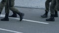 Detachment of national guards crossing road, protection mass gathering of people