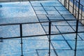 detail from above of a blue paddle tennis court, racket sports concept