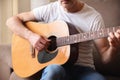 Detail of guitar body and man playing man playing Royalty Free Stock Photo