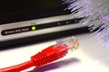 Detail of ADSL modem router with luminescent fiber optic lights and lan cable rj45 Royalty Free Stock Photo