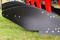 Detail of agricultural black plow, modern technology in agriculture concept