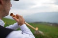 Detail of an Alpine horn player. On the Alps Royalty Free Stock Photo