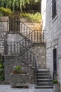 Detail of the ancient cast iron railing on a stone staircase in the old town of Kotor, Montenegro Royalty Free Stock Photo