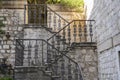 Detail of the ancient cast iron railing on a stone staircase in the old town of Kotor, Montenegro Royalty Free Stock Photo