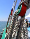 Detail of ancient pulleys and ropes or cords on the prow or bow of the sailboat Amoroso, a historical, typical or traditional Royalty Free Stock Photo