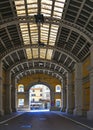 Detail of Anghiari italian medieval village with historical covered liberty commercial gallery with arches. Arezzo, T