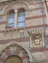 Angle of an ancient bicolored building to Neptune in Italy.