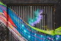 Detail of an anonymous street graffiti with many colors, cheerful urban background Royalty Free Stock Photo