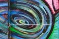 Detail of an anonymous street graffiti with many colors, cheerful urban background Royalty Free Stock Photo