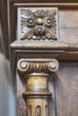 Detail of antique carved solid walnut sideboard facade.