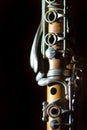 Detail of Antique clarinet on a black background