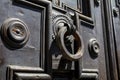 Detail of an antique wooden door with a knocker Royalty Free Stock Photo