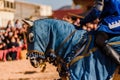 Detail of the armor of a knight mounted on horseback during a display at a medieval festival