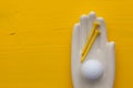 Detail of artifical hand with golf equipments