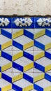 Detail azulejos tiles blue and yellow with stone wall