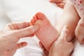 Detail baby having foot massage Royalty Free Stock Photo