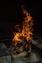 Detail of barbecue or fireplace fire burning pieces of wood in its beginnings Royalty Free Stock Photo