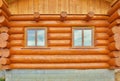 Detail of beams in cabin wall. Painted wood with fungicide paint and wooden window