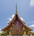 Detail of the beautiful mosaic `The Tree of Life` in the famous Wat Xieng Thong temple of Luang Prabang, Laos Royalty Free Stock Photo