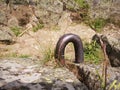 Mountain rocks detail with rusty metallic object