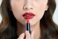 Detail of a beautiful woman applying lipstick Royalty Free Stock Photo