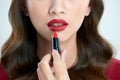 Detail of a beautiful woman applying lipstick Royalty Free Stock Photo