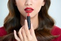 Detail of a beautiful woman applying lipstick Royalty Free Stock Photo