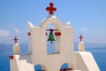 Detail of bell and crosses on traditional cycladic church, Santorini