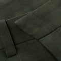 Detail of the belt of a checkered dark green trousers with a loop and fly