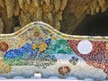 Bench of cut colored ceramics in the Parc Guel of Barcelona in Spain. Royalty Free Stock Photo