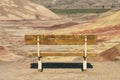 Detail of a bench facing the colorful landscape in Painted Hills Overlook